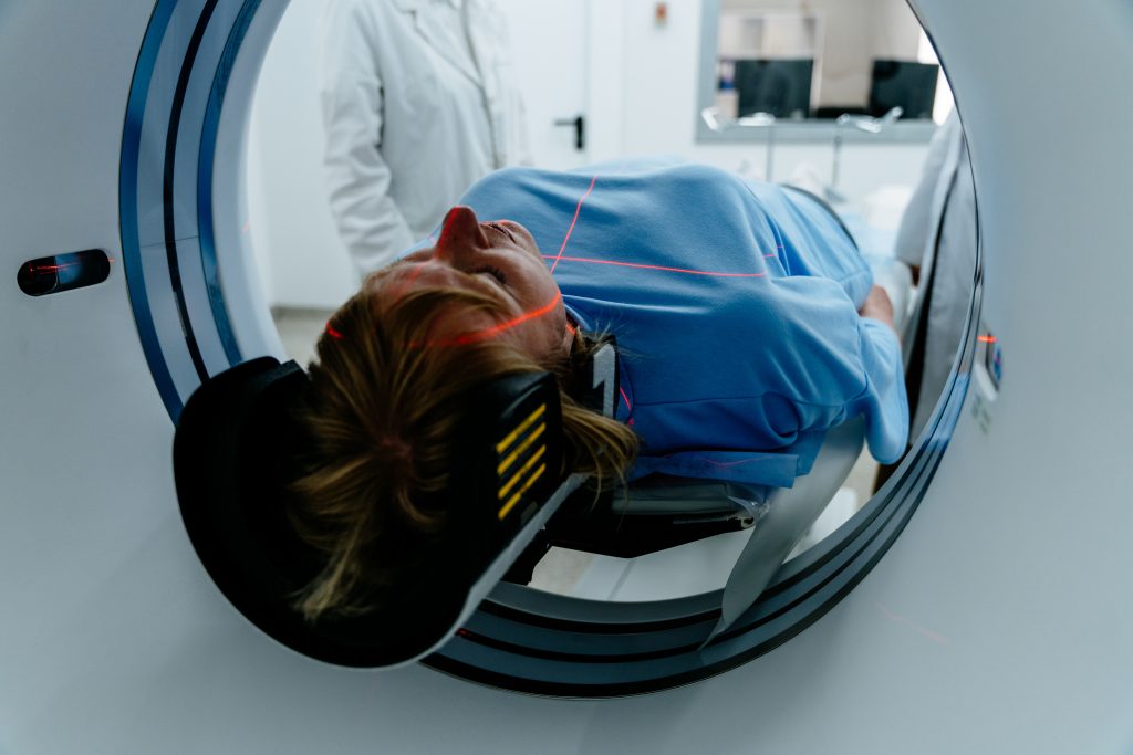 Female patient in an MRI machine for Spine and Nerve Compression Symptoms