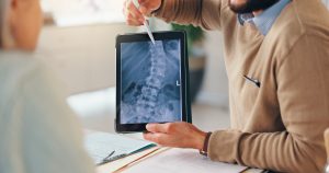 Patient discussing non-opioid pain management options for back, neck, joint, and nerve pain